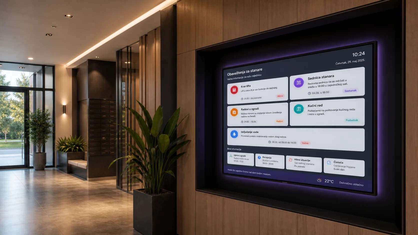 Digitalni ekran u modernom ulazu stambene zgrade